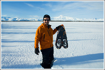 Hiker with snowshoes, winter, Wrangell-St. Elias National Park, Alaska.
