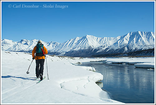 Backcountry cross country skiing, along the Kennecott River, near McCarthy, springtime, breakup, Wrangell-St. Elias National Park, Alaska.