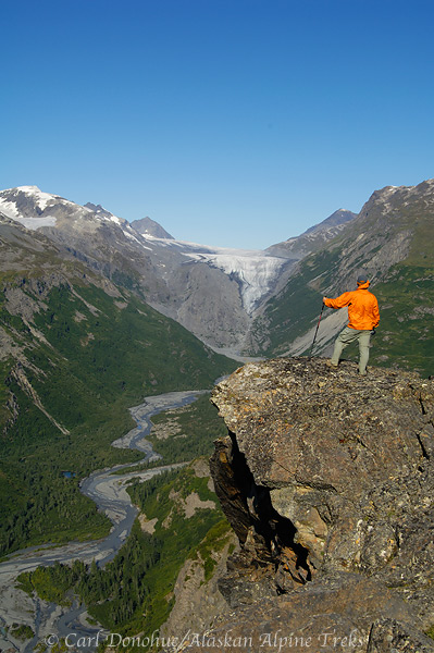 On the Bremner Mines to Tebay Lakes trip, this hiker takes in the view,  Wrangell-St. Elias National Park and Preserve, Alaska.