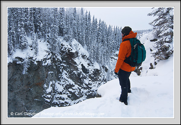 Hiking in winter along the rim of the Kuskulana Gorge, Wrangell-St. Elias National Park and Preserve, Alaska.