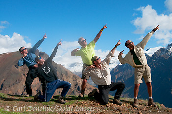 5 intrepid backpackers do 'usain bolt' after crossing the Goat Trail, Wrangell-St. Elias National Park, Alaska.