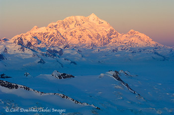 Mount Saint Elias, 18 008' high,catches the last of the sun's rays for the day, Wrangell-St. Elias National Park and Preserve, Alaska | aerial photo.